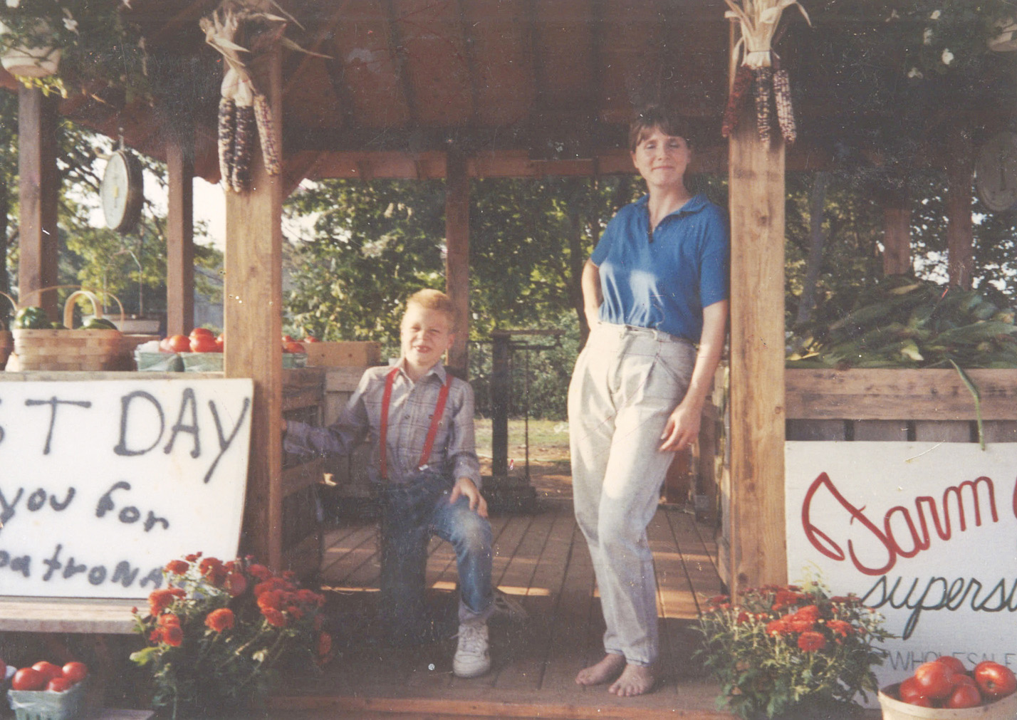 Monica Harbes and son Jason Harbes Standing in Harbes original farm stand gazebo